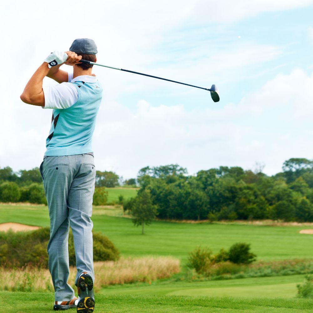 guy teeing off