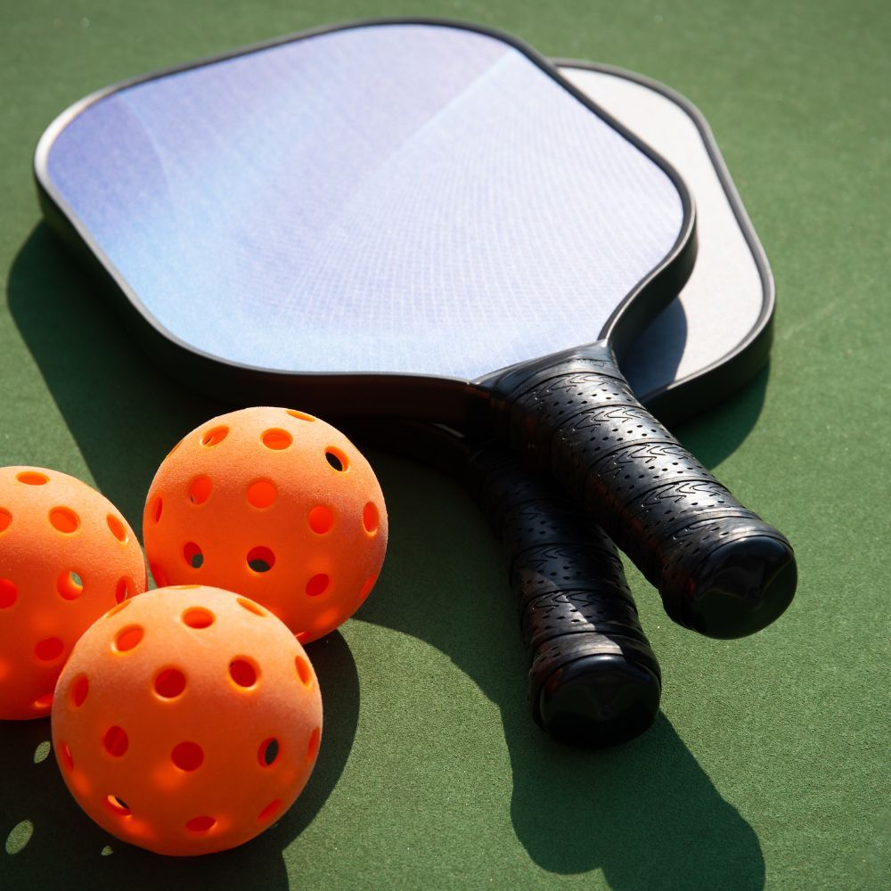 A pickleball player holding a paddle