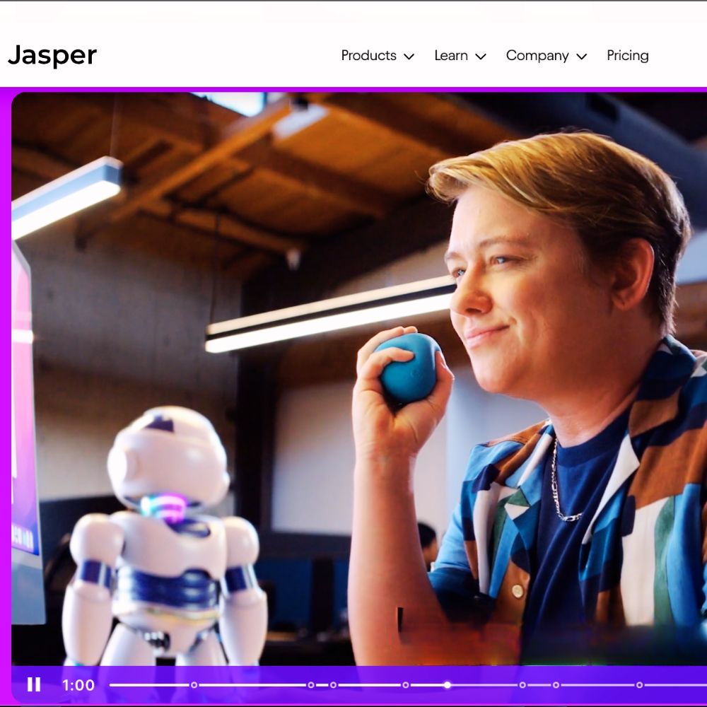 A computer screen with Jasper AI logo and text "Jasper AI - AI-powered content creation"
