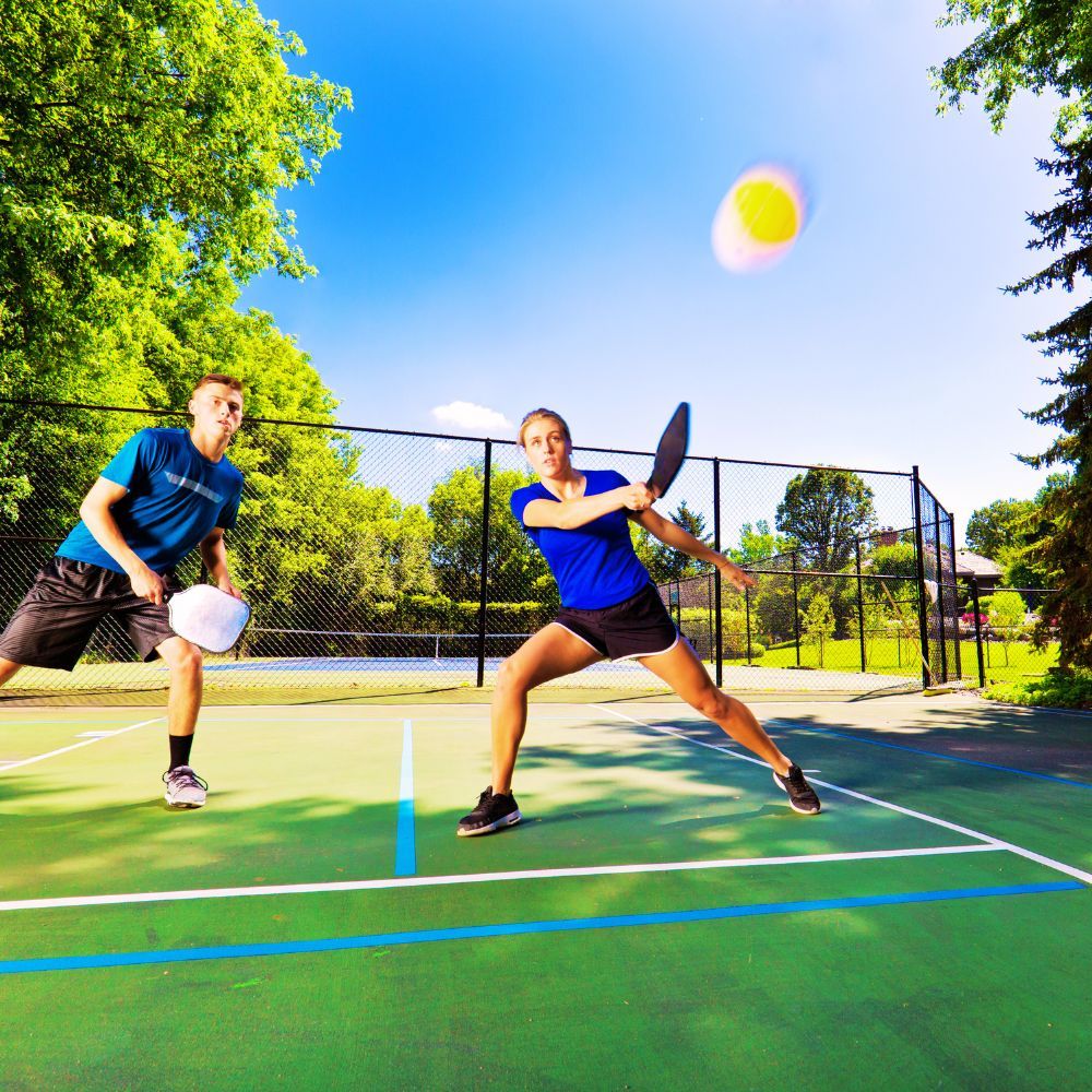 A pickleball player making a lateral movement