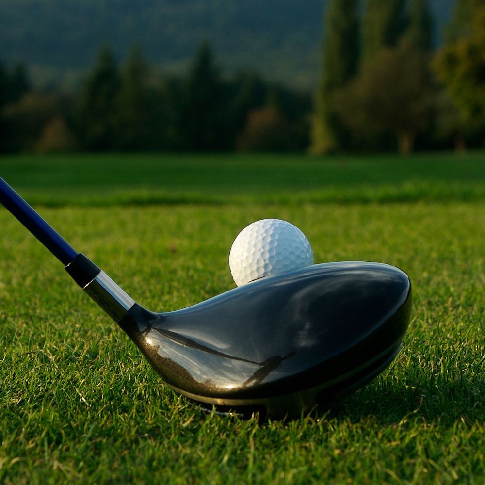 A golfer hitting a game improvement fairway wood