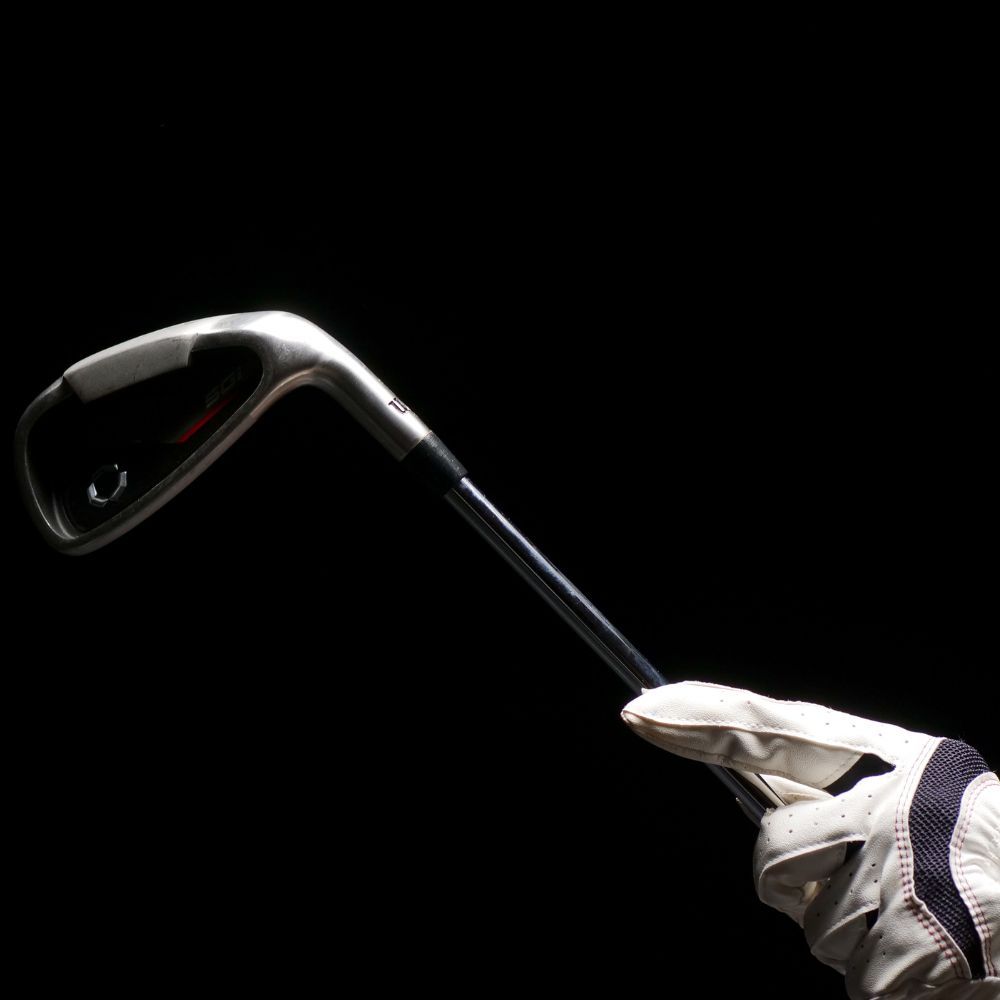 A golfer hitting a game improvement wedge