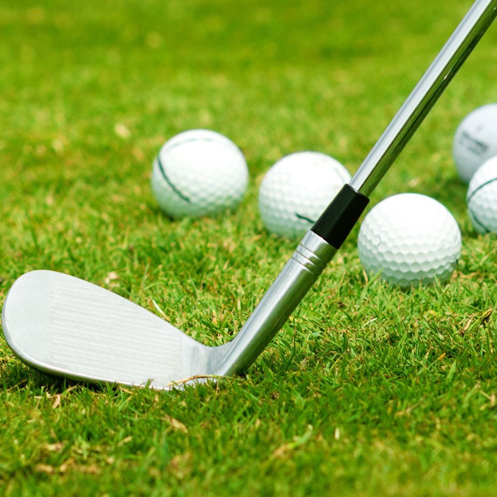 A golfer playing with Mizuno irons